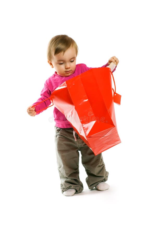Baby girl in shopping bag stock image. Image of isolated 12476323