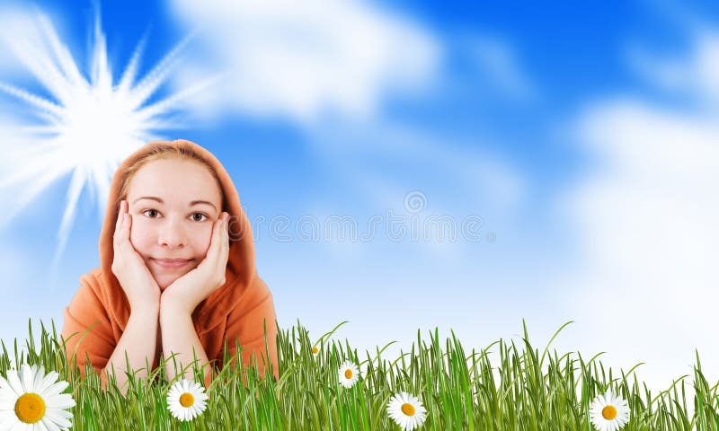 Smiling girl on spring meadow