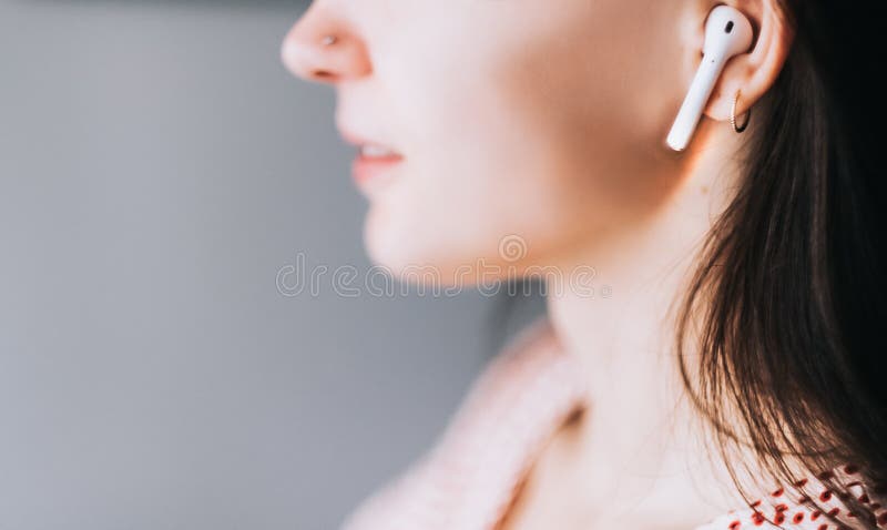 Smiling Girl talking in apple AirPods
