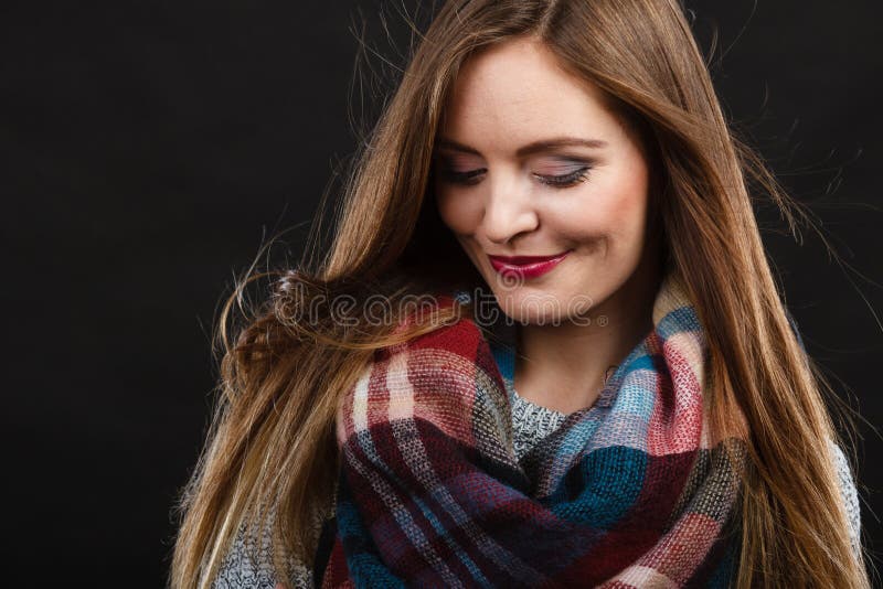 Smiling girl wearing warm wooden scarf royalty free stock images Smiling girl wearing warm wooden scarf royalty free stock images