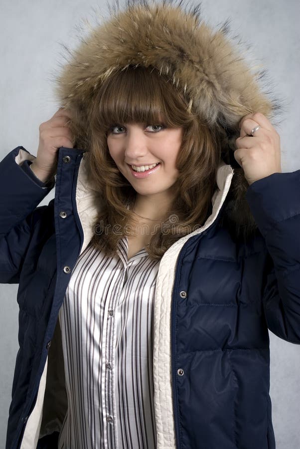 A smiling girl in a winter jacket