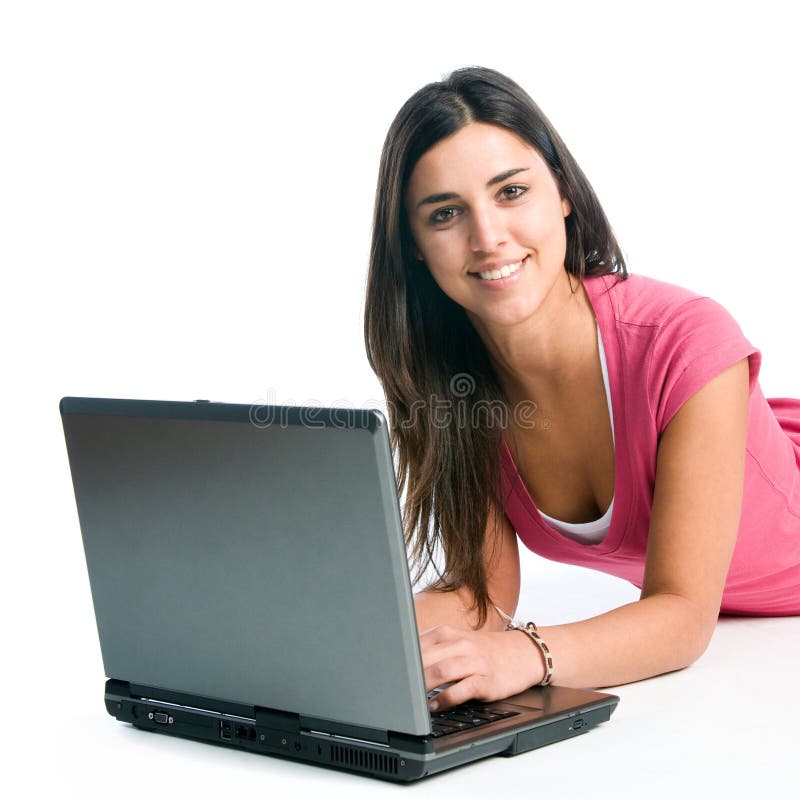 Young latin smiling woman working on laptop isolated on white background. Young latin smiling woman working on laptop isolated on white background