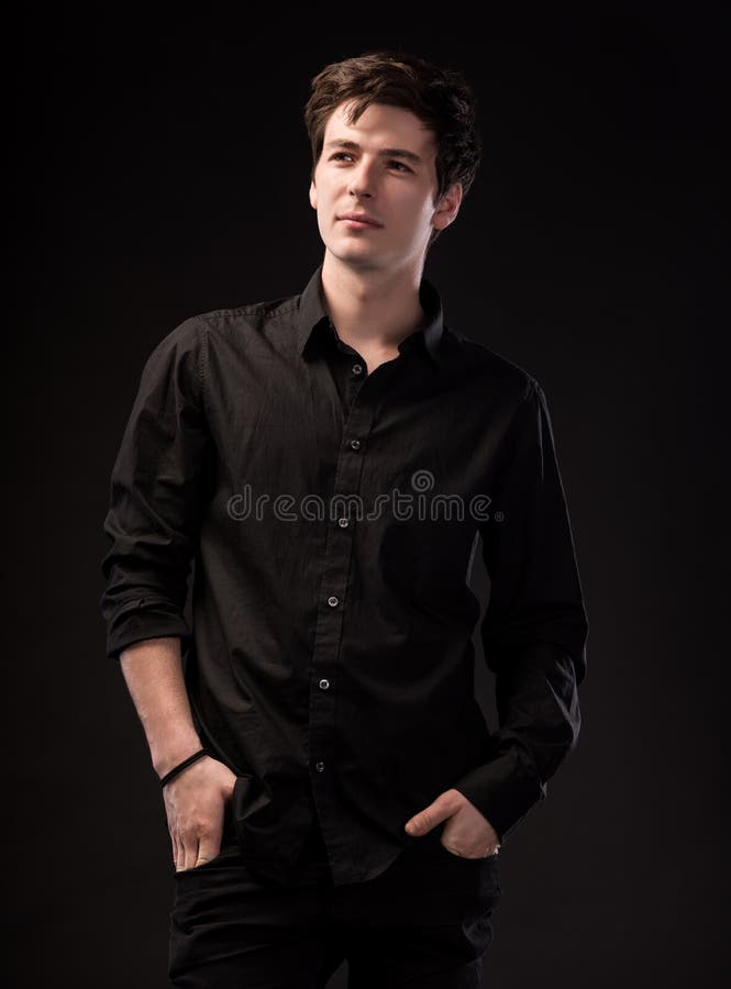 Smiling Handsome Man in Black Shirt Posing on a Black Background Stock  Photo - Image of people, nice: 164425044