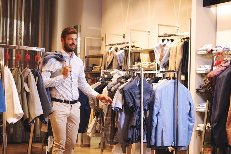 Smiling Handsome Man Buying Clothes Stock Image - Image of menswear ...