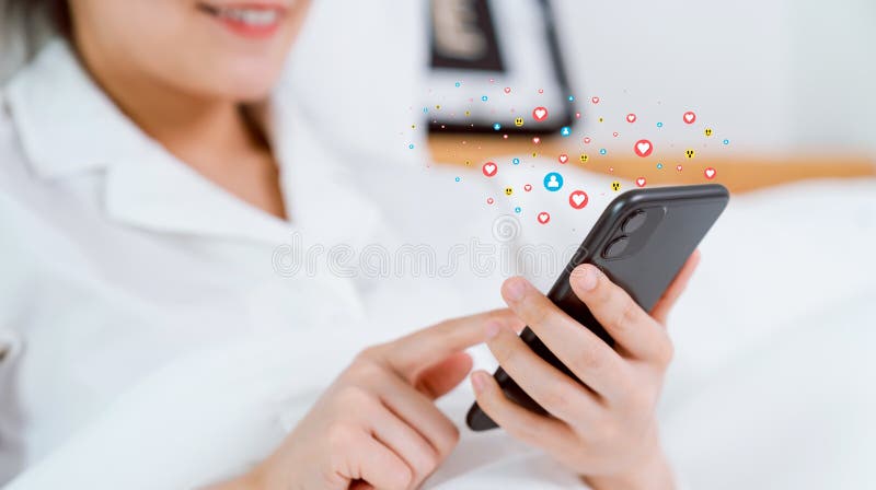Smiling happily woman hand using smartphone and show heart icon social media. Concept social network. royalty free stock images