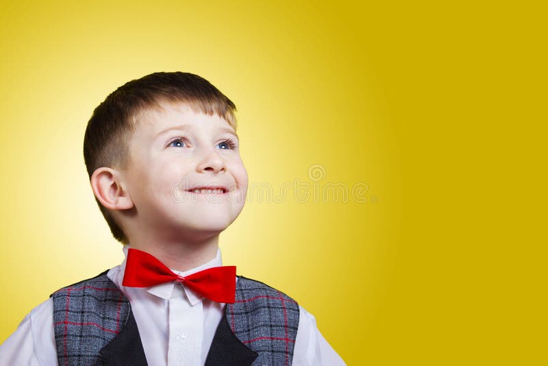 Smiling, Happy, Joyful beautiful little boy, looking up.Close-up Studio Portrait isolated on blue background. royalty free stock photo Smiling, Happy, Joyful beautiful little boy, looking up.Close-up Studio Portrait isolated on blue background. royalty free stock photo