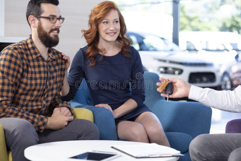 Smiling and happy marriage buying new car in exclusive showroom stock photos Smiling and happy marriage buying new car in exclusive showroom stock photos