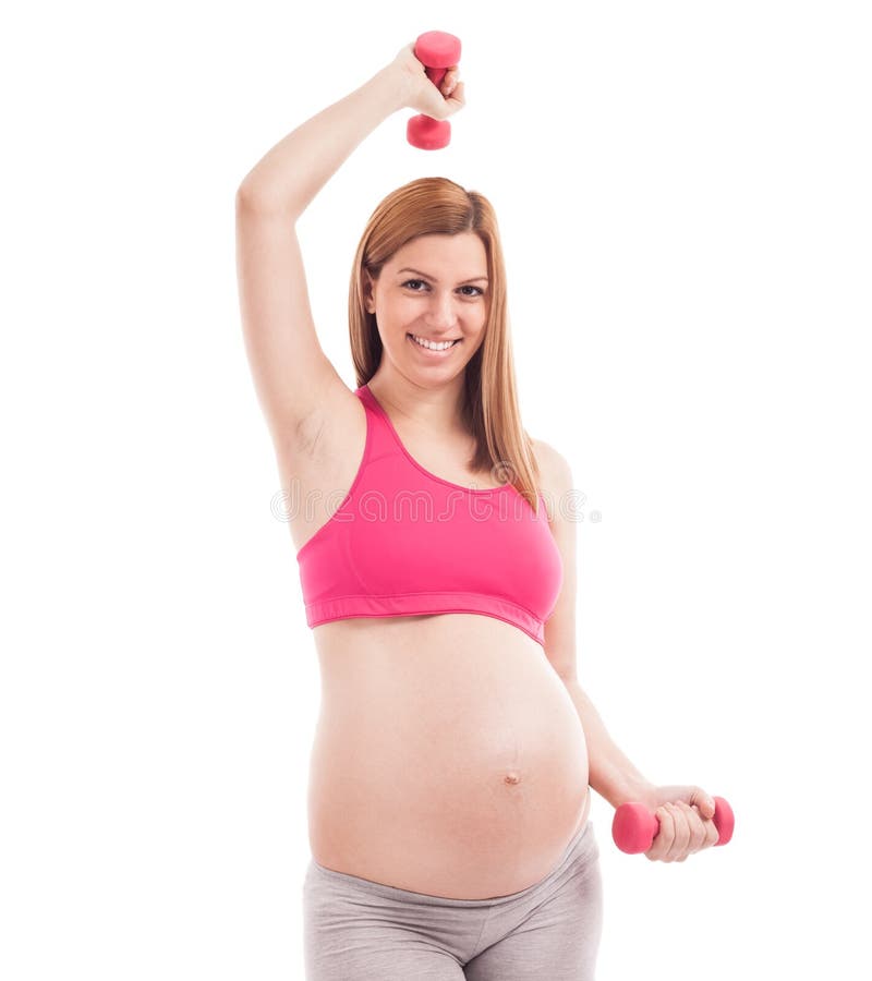 Smiling happy pregnant woman doing exercise with dumbells royalty free stock image Smiling happy pregnant woman doing exercise with dumbells royalty free stock image