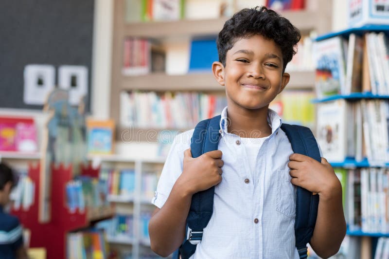 Smiling hispanic boy at school stock photo