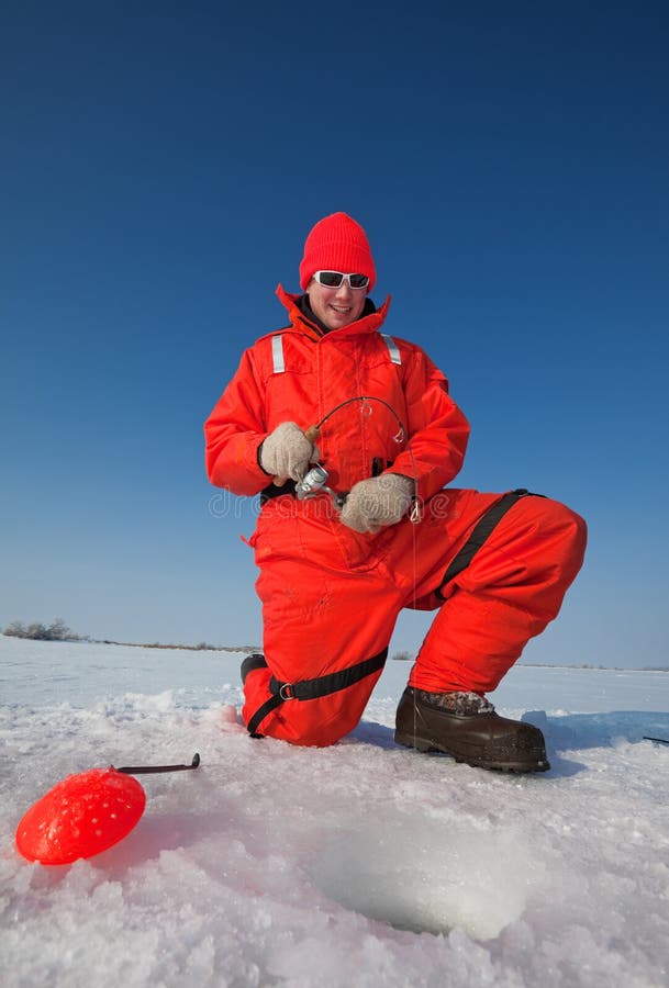 Smiling ice fisherman royalty free stock photo