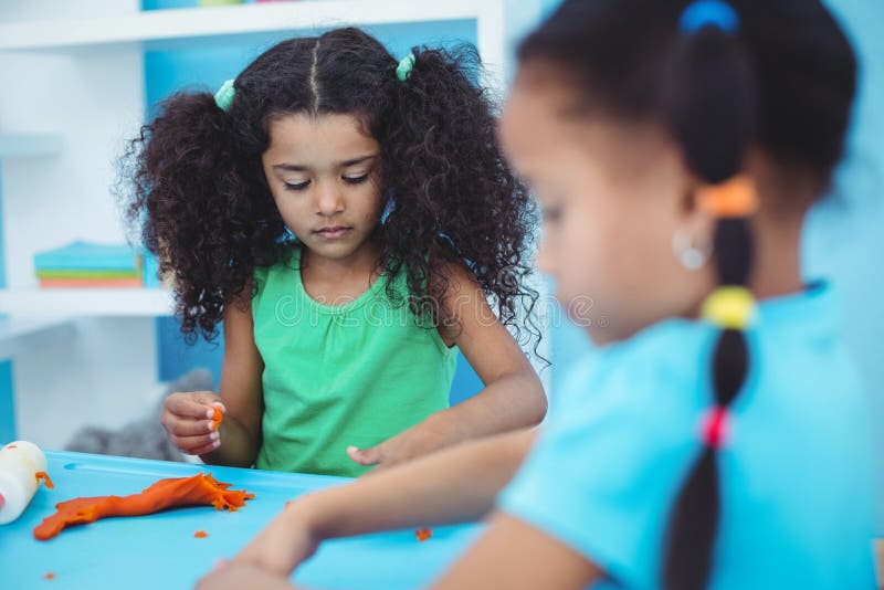 Smiling Kids Using Modelling Clay Stock Image - Image of length