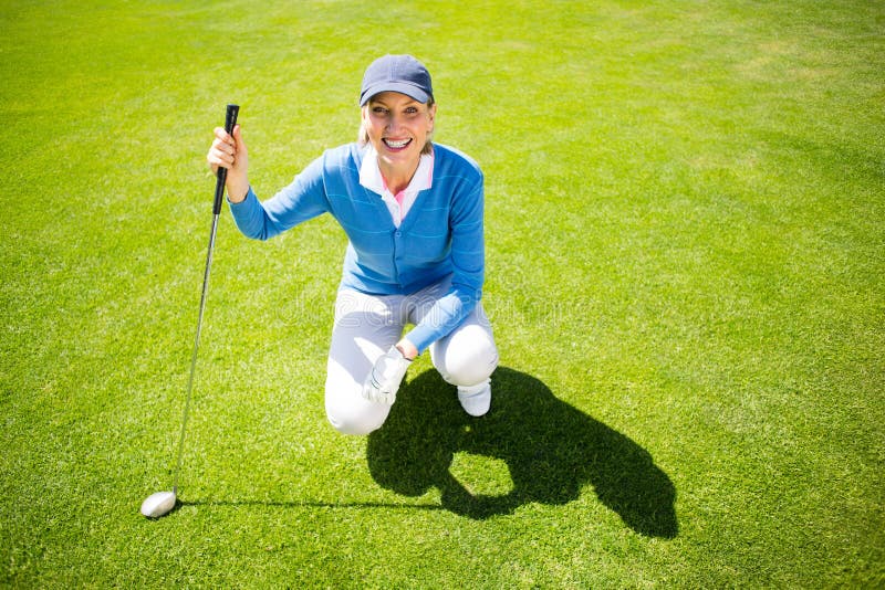 Smiling Lady Golfer Kneeling on the Putting Green Stock Image - Image ...