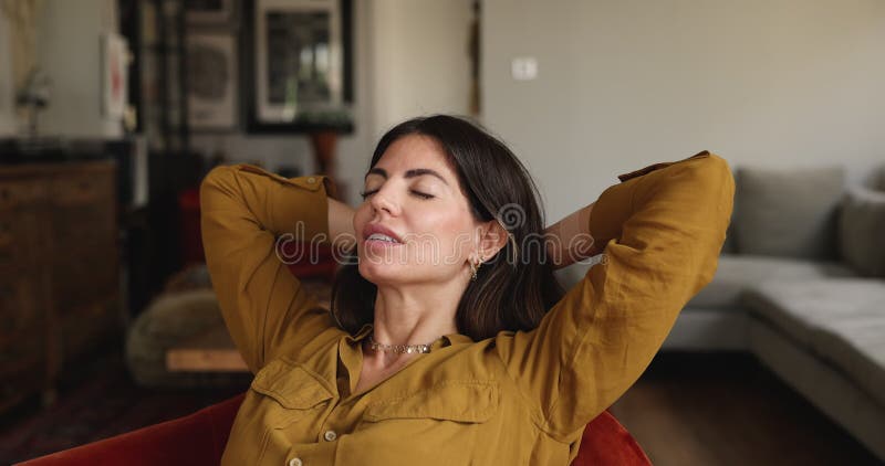Smiling Latina woman enjoy daytime nap with her eyes closed stock footage