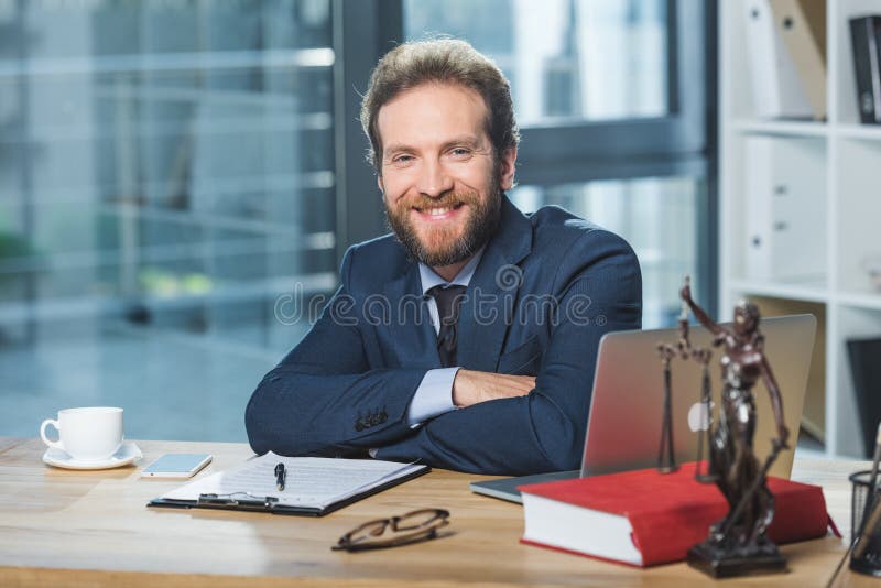 Smiling lawyer at workplace stock image Smiling lawyer at workplace stock image