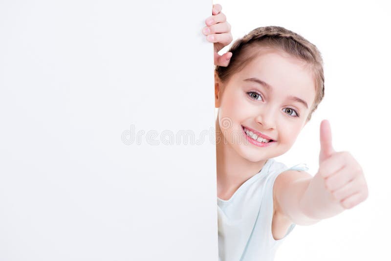 Smiling little girl holding empty white banner.