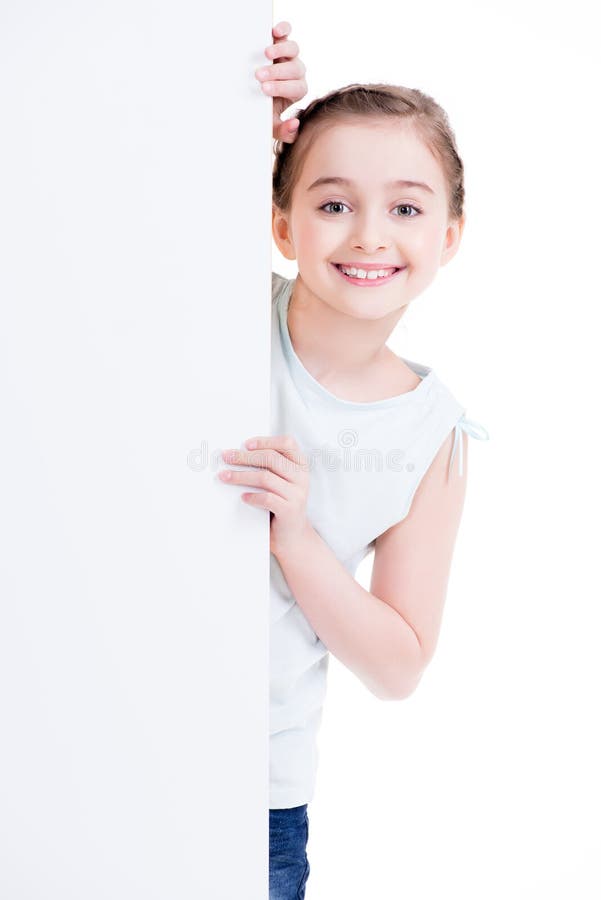 Smiling little girl holding empty white banner.