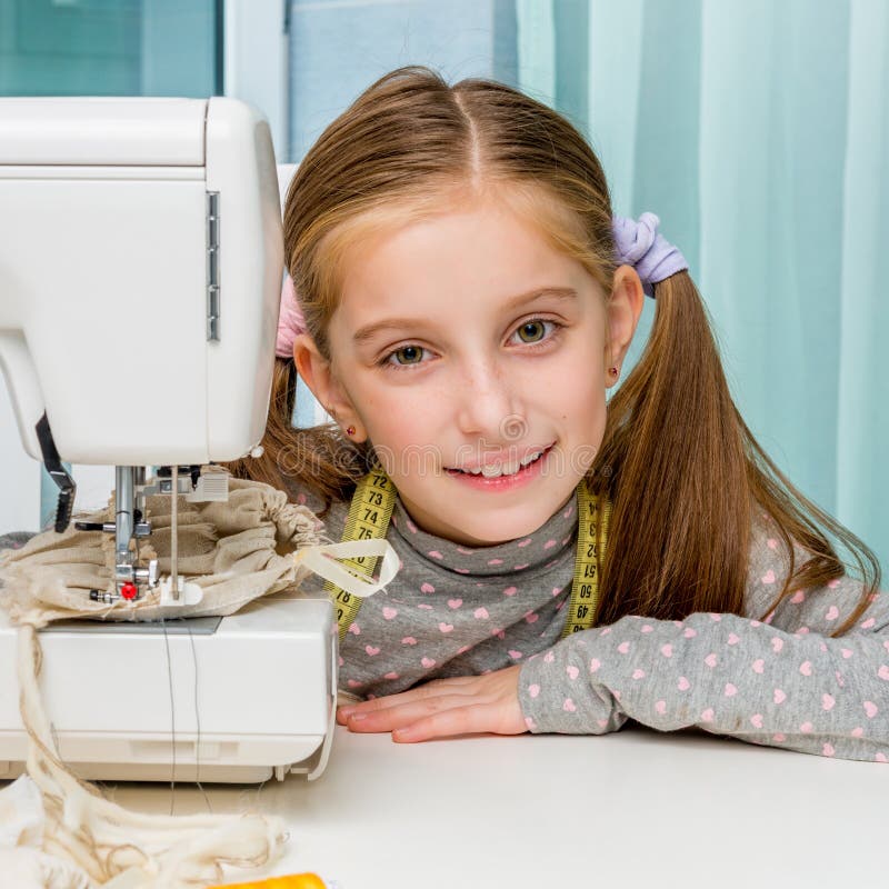 Smiling Little Girl at the Table with Sewing Stock Image Image of