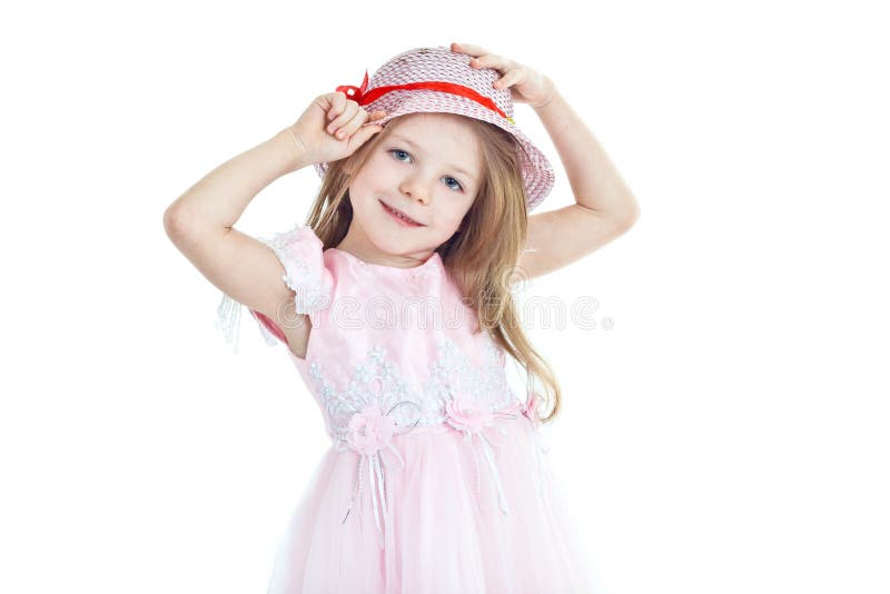 Smiling little girl trying on hat