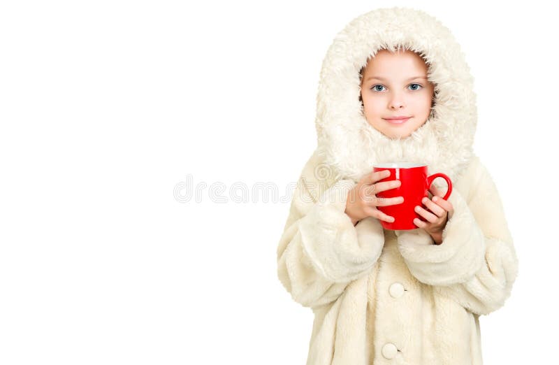 Smiling little girl in winter clothes with a red cup of hot drink