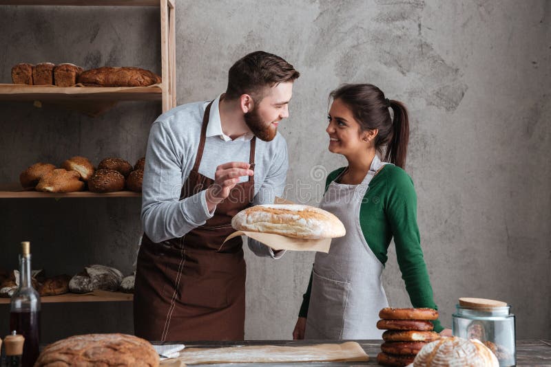 Smiling Loving Husband Feeding Wife, Young Couple Enjoying Tender Moment, Romantic Date, Having