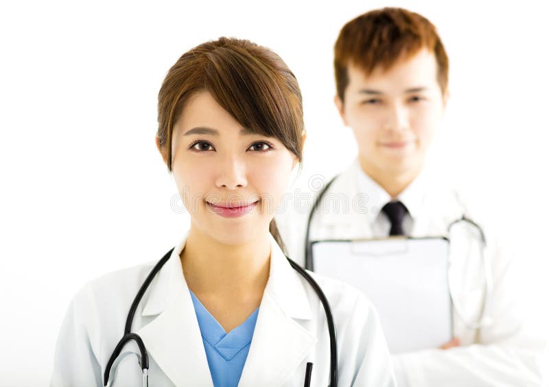 Smiling male and female doctors standing together royalty free stock images