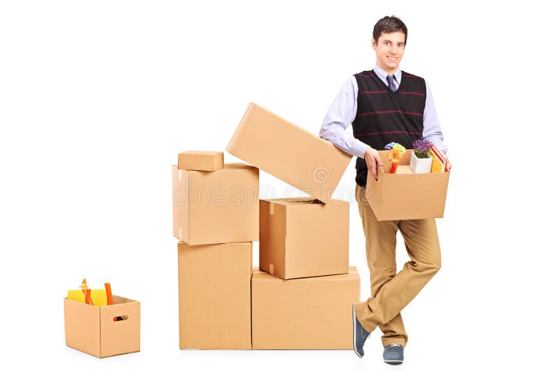 Smiling male holding a box royalty free stock photo