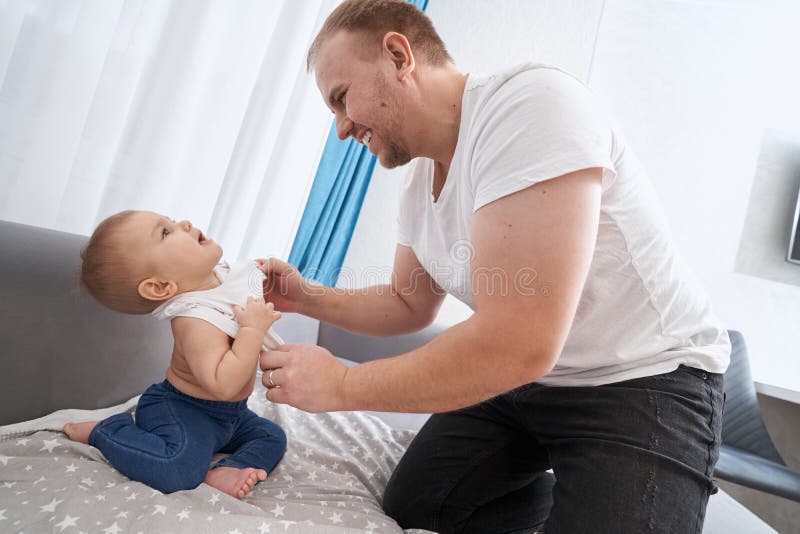 Little Girl Pulling Up Her Shirt