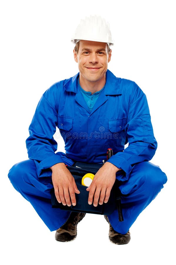 Smiling male worker wearing safety hat royalty free stock photo