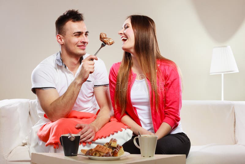 Smiling Man Feeding Happy Woman with Cake. Stock Image - Image of woman ...