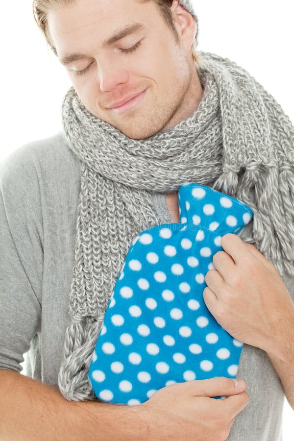 Smiling man with heating pad