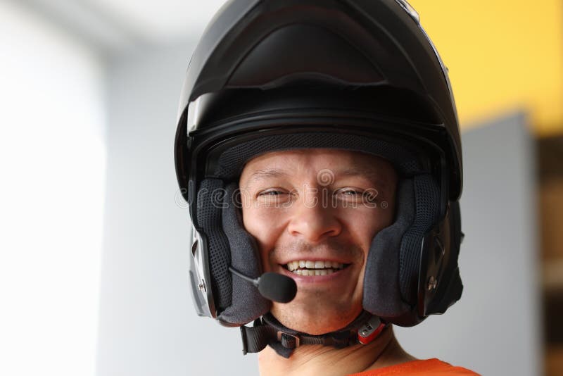 Smiling Man in Motorcycle Helmet with Speakerphone Stock Photo - Image