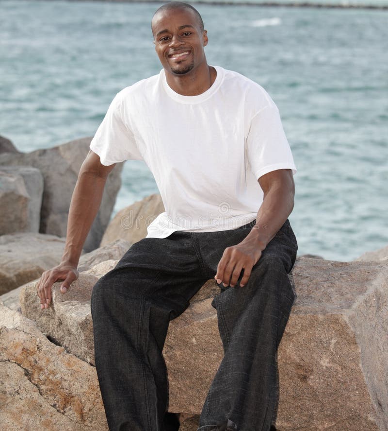 Smiling man on the rocks