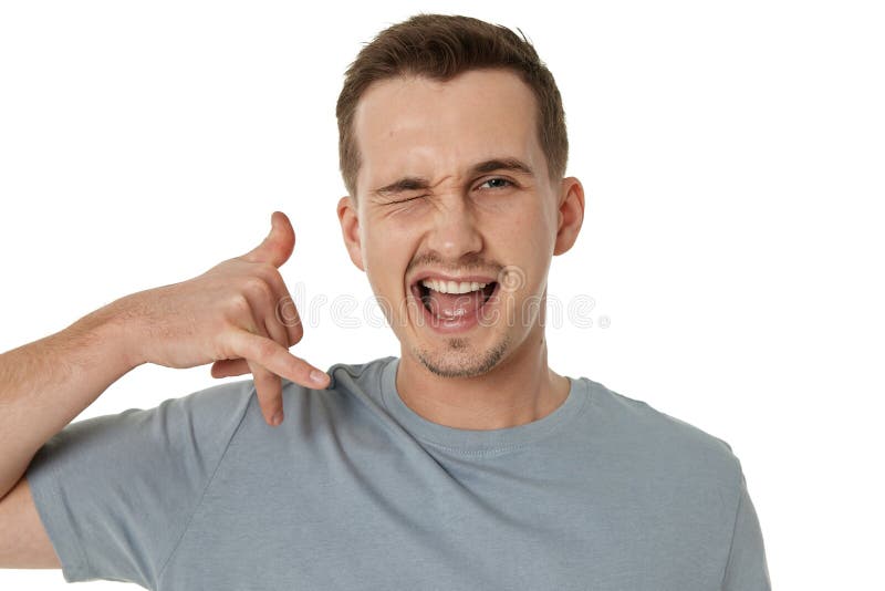 smiling man showing phone gesture on white background royalty free stock photo