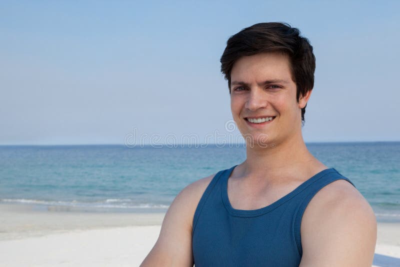 Smiling Man Standing at Beach on a Sunny Day Stock Image - Image of ...