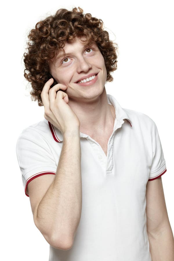 Happy man answering the phone against a white background. Happy man answering the phone against a white background