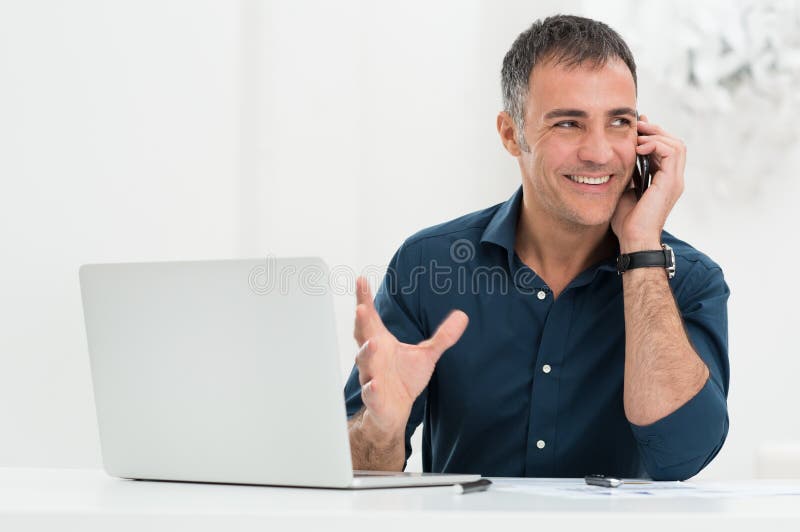 Smiling Man Talking On Cellphone stock images