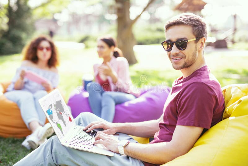 Smiling man working on his project stock image