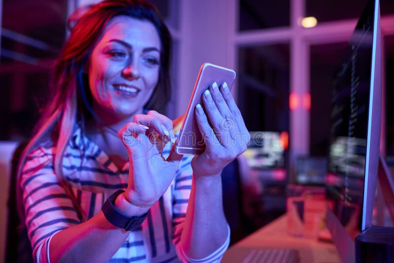Businesswoman using mobile phone for communication royalty free stock photography