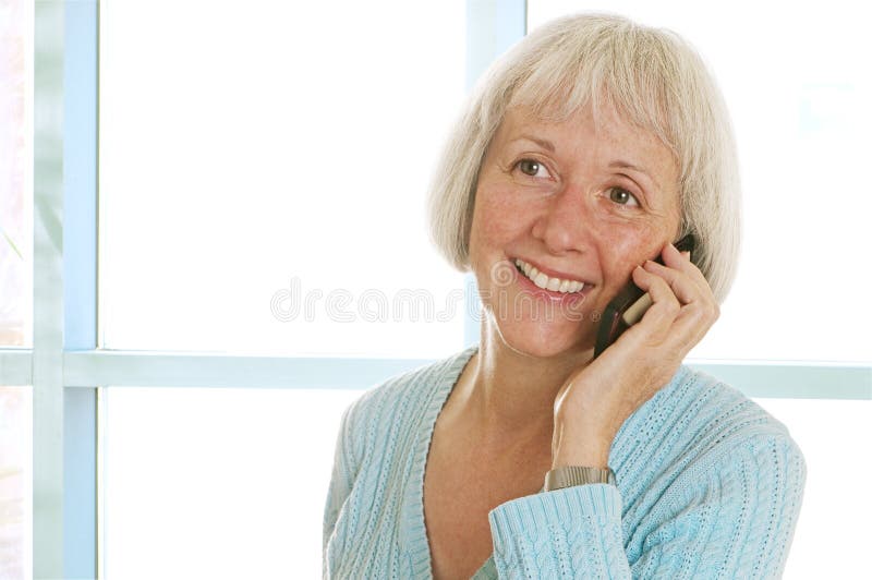 Smiling Mature Woman Talking On Cell Phone