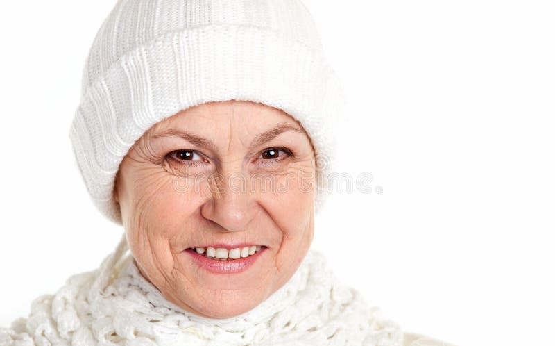 Smiling mature woman in winter cap stock photo Smiling mature woman in winter cap stock photo