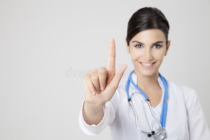 Smiling medical doctor woman. Focus on hand