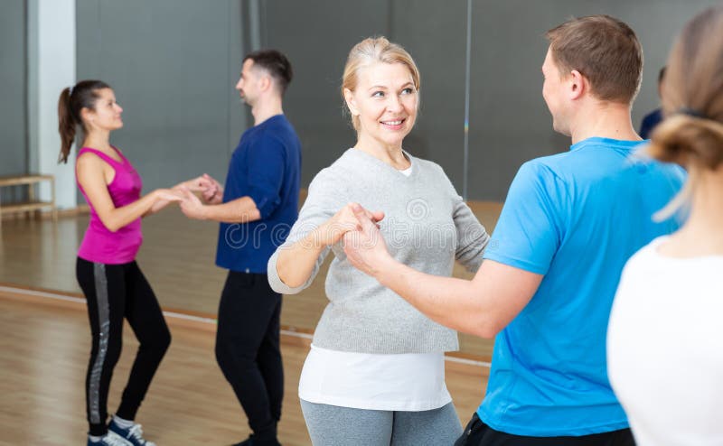 Mature Dancing Couple during Group Class Stock Image - Image of woman