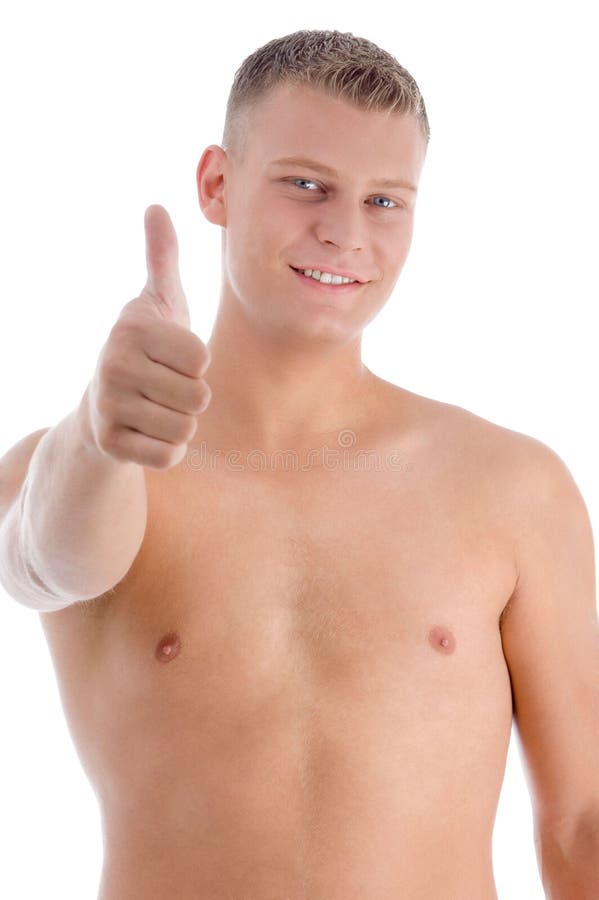 Smiling muscular man showing approval sign