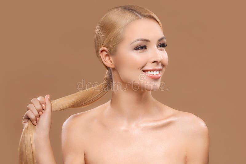 smiling naked blonde beautiful woman with long hair