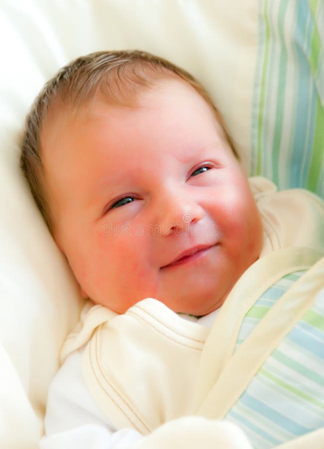 Smiling newborn baby girl