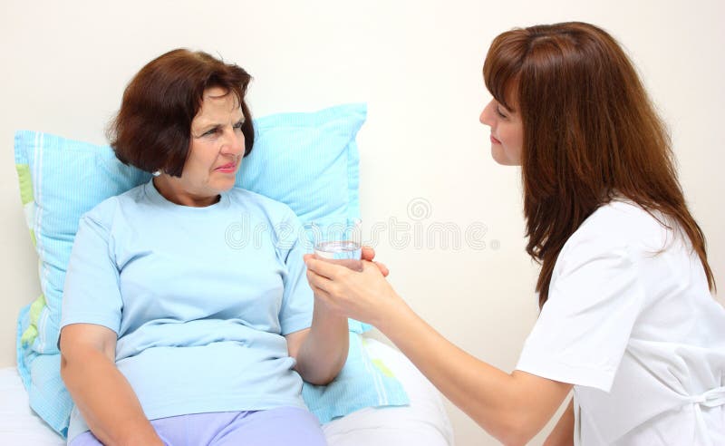 A smiling nurse and a patient