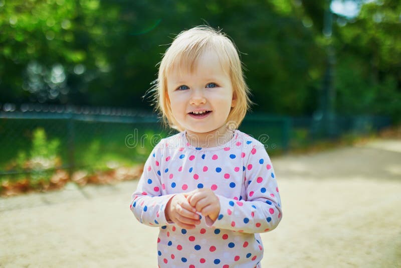 Smiling One Year Old Girl Walking in Park Stock Photo - Image of care ...