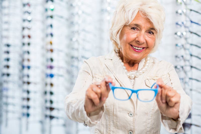 Smiling opticians patient stock photos