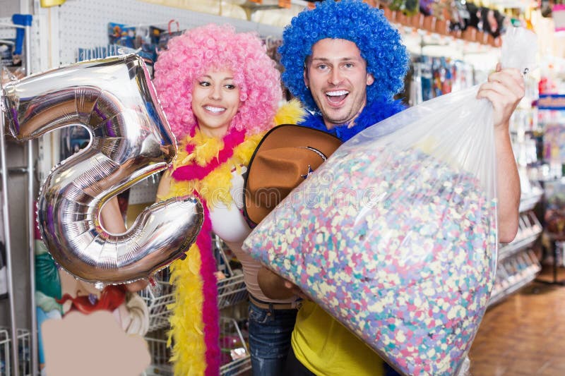 Smiling Pair with Big Sack of Confetti in Store Stock Photo Image of