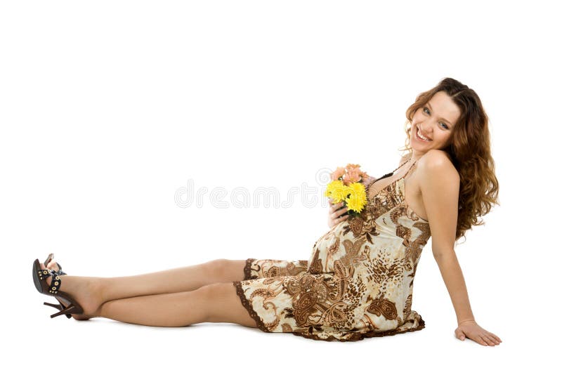 Smiling pregnant brunette with flowers